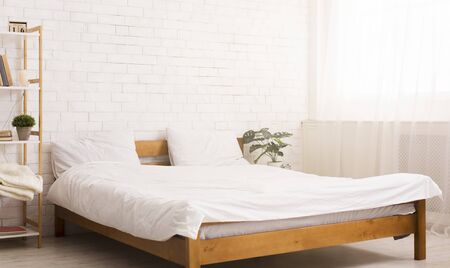 Comfortable bedroom. Light cozy room interior with bed, empty space