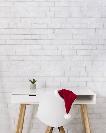 Santas office after Christmas with workplace over bricks wall, copy spaceの写真素材