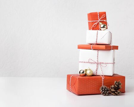 Collection of Christmas presents with cones on white background, copy spaceの写真素材