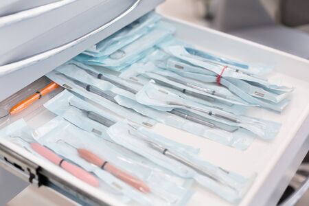 Close up of sealed dentist tools in open drawer, dental equipment conceptの写真素材