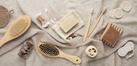 Various spa and beauty and treatment products on cotton brown towel, panorama