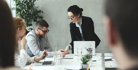 Creative people analyzing data on meeting in office, brainstorming and discussing startup projectの写真素材