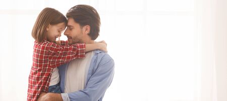 Fatherhood, care, family concept. Lovely father and daughter embracing at home, panorama with copy...
