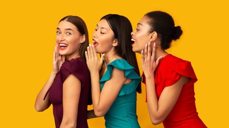 Gossip Spreading. Three Millennial Girls Whispering Secrets Telling Each Other Latest Rumors Over...