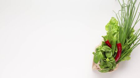 Healthy vegetables vitamins in paper bag isolated on white background, panorama, copy spaceの写真素材