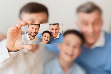 Three Generations Family Selfie. Man, His Son And Elderly Father Taking Picture Of Themselves On...