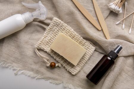 Natural eco bamboo toothbrush, coconut soap, handmade detergent, crystal deodorant, ear sticks on towel,の写真素材