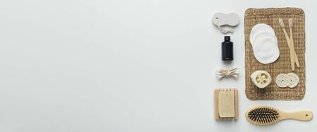 Zero waste bathroom items of bamboo eco material on white background, panorama, copy space