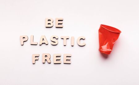 Environmental pollution with plastic waste and the danger of microplastics for human health. Be plastic free text isolated on white backgroundの写真素材