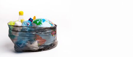 Earth world globe and plastic bottle waste on white background. Save the planet Earth from plastic bags conceptの写真素材