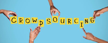 Open resource for ideas and innovations, crowdsourcing concept. Hands setting up crowdsourcing word...