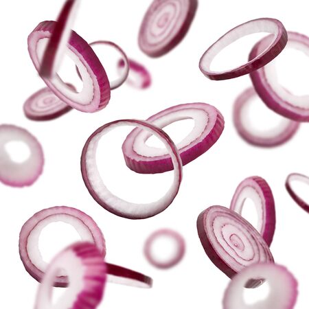 Winter prevention of diseases. Fresh flying red onion over white background, isolated