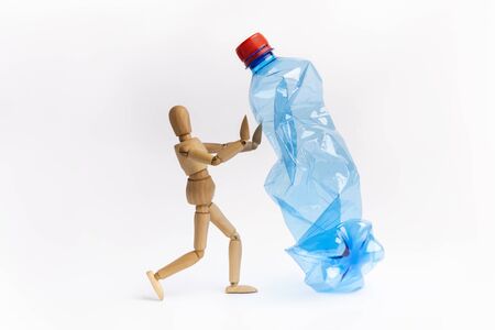 Creative artwork of mannequin stop or prohibition using plastic bottles on white background urging people not to use the item to prevent marine pollutionの写真素材