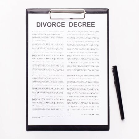 Decree of divorce, dissolution, canceling marriage, legal separation document isolated on white backgroundの写真素材