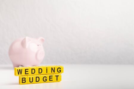 Wedding piggy bank for savings. Concept of marriage, wedding budget, gray background, copy spaceの写真素材
