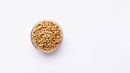 Simplicity of healthy diet. Soybeans in glass bowl isolated on white background, panoramaの写真素材
