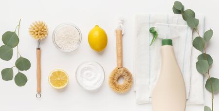 Eco cleaning household background. Cleaning products flat lay, baking soda, lemon vinegar and bamboo brush on white background, panoramaの写真素材