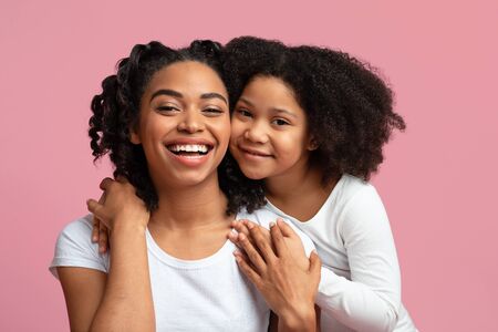 Mothers Love. Portrait Of Happy African Mom Posing With Her Adorable Little Daughter, Hugging And...