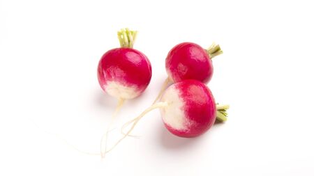 Organic vegetables concept. Purple radishes on white background empty spaceの写真素材