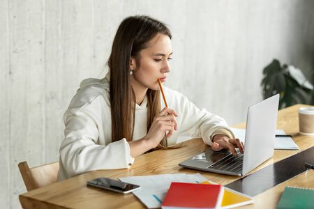 Work at convenient time. Freelance beautiful girl working at laptop