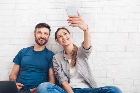 Happy selfie of young couple buying new flat and starting repair, copy space