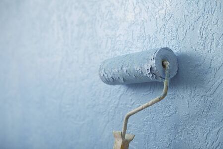 New interior concept. Paint roller colour wall texture in blueの写真素材