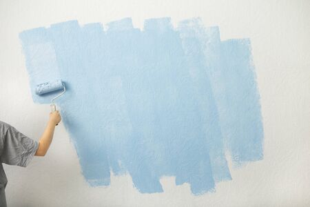 First layer of blue paint on the wall, free space