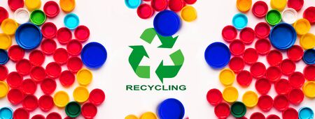 Reuse of waste concept. Collage with plastic bottle caps and recycling sign on white background, flat lay. Panoramaの写真素材