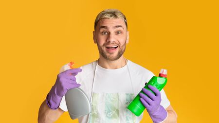 Guy with cleaning supplies in his hands, free spaceの写真素材