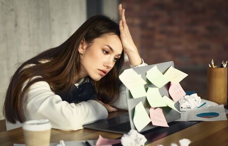 Burnout at work. Freelance girl has many tasks, but no strength