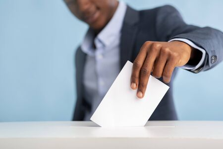 Elections in america USA 2020, 3 of november. African man voted on president elections, blurred...