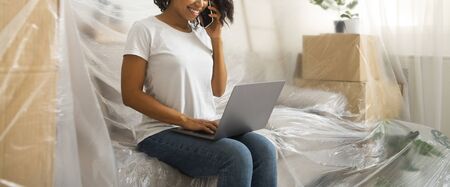 African american woman covered all furniture polyethylene, seeking professional for repair on...