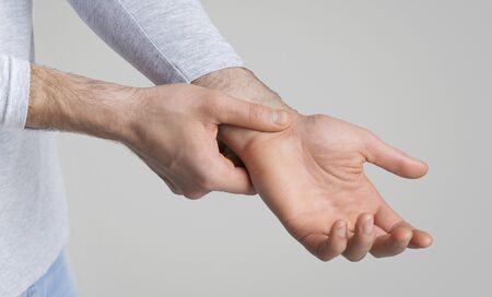 Check the pulse. Man counts heartbeats by himself, panoramaの写真素材