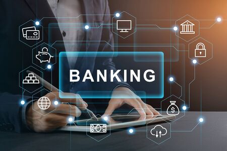Electronic banking concept. Businessman using online financial service on tablet computer, creative collage with pictogramsの写真素材
