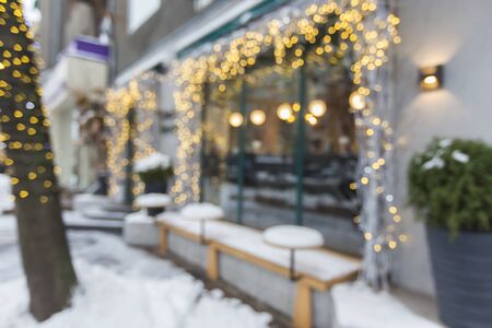 Blurred exterior of luxury restaurant with holiday decorations, copy spaceの写真素材
