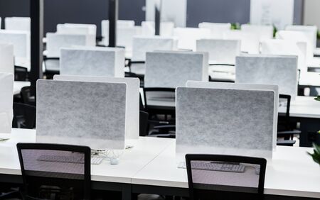 Empty places for workers in big empty rental office, coronacrisis, unemployment