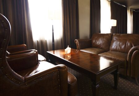Interior of office for business meetings with leather chairs, sofa and tableの写真素材