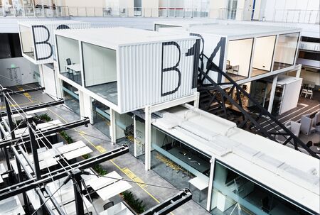 Angle view on big office with loft rooms for conference, copy space, quarantine, no peopleの写真素材