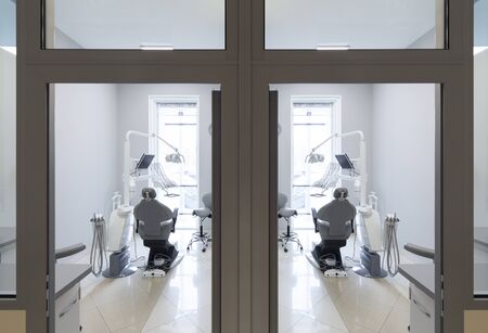 Medical rooms with modern dentist equipment, view out of the doors, professional treatmentの写真素材