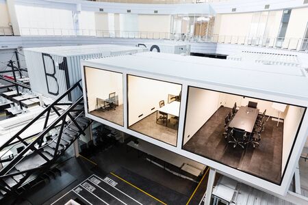 Three rooms with glass wall in modern corporation, office interior, copy space, no people