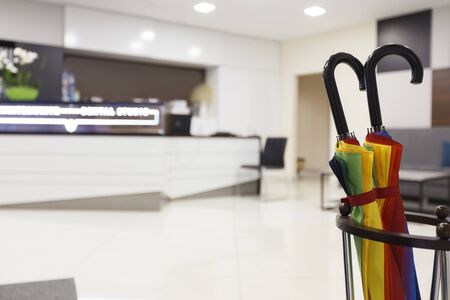 Colored umbrellas as part of decoration on reception in private hospital, blurred background, copy spaceの写真素材
