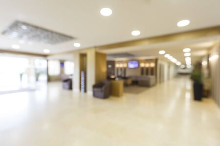 Blurred corridor and entrance of large hotel at day, free spaceの写真素材