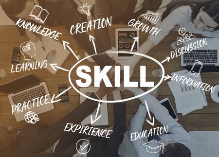 Teamwork of employees for business with laptops and gadgets. Double exposure with inscriptions knowledge, creation, experience learning practice and skillの写真素材