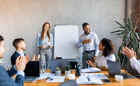Corporate Meeting. Business Team Applauding After Successful Presentation Of Startup In Modern Office. Selective Focusの写真素材