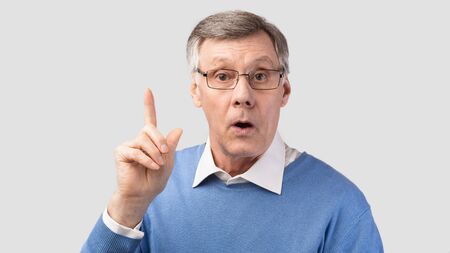 Idea. Elderly Gentleman Having Eureka Moment Pointing Finger Up Posing Over Gray Background....
