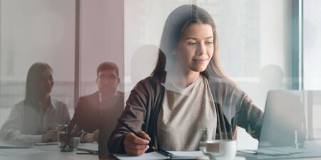 Collage with young businesswoman working on laptop and her colleagues on meeting, double exposure....