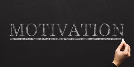 Businesswoman writing word MOTIVATION on chalkboard, creative collage. Panoramaの写真素材