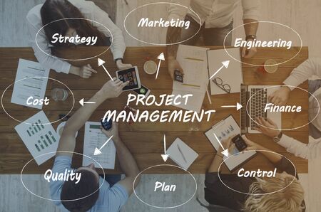 Illustrative idea of project management over top view of working at office business team