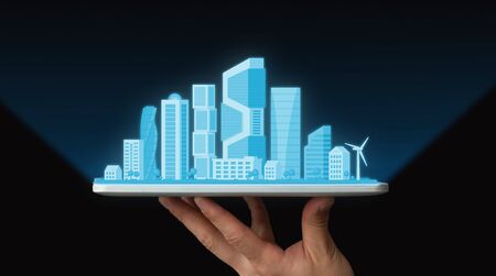 Male Hand Holding Tablet With Modern City Plan Over Black Background. Futuristic Architecture...