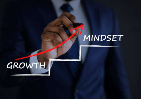 Personal Growth Concept. Unrecognizable Businessman Drawing Arrow Up From Word Growth To Mindset Over Black Background. Collage, Croppedの写真素材